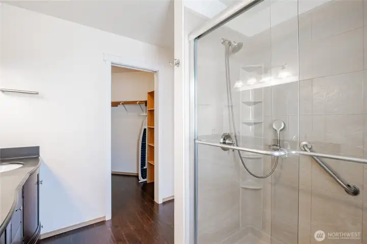 primary shower with handrail and seat primary shower with handrail and seat