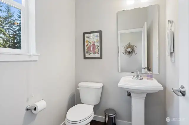 1/2 bath situated just off of the kitchen for convenience.