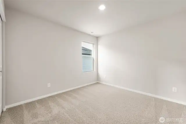 Guest Bedroom. Photos of previously built home of same floorplan. Colors, Specifications, and Options may vary on actual home.