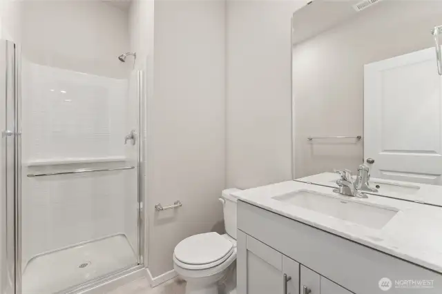 Main Floor Guest Bathroom. Photos of previously built home of same floorplan. Colors, Specifications, and Options may vary on actual home.