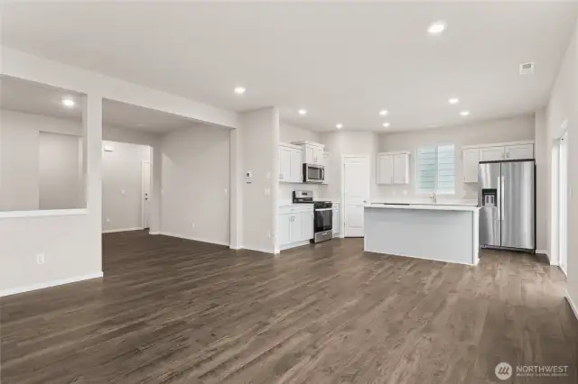 Living Room and Kitchen. Photos of previously built home of same floorplan. Colors, Specifications, and Options may vary on actual home.