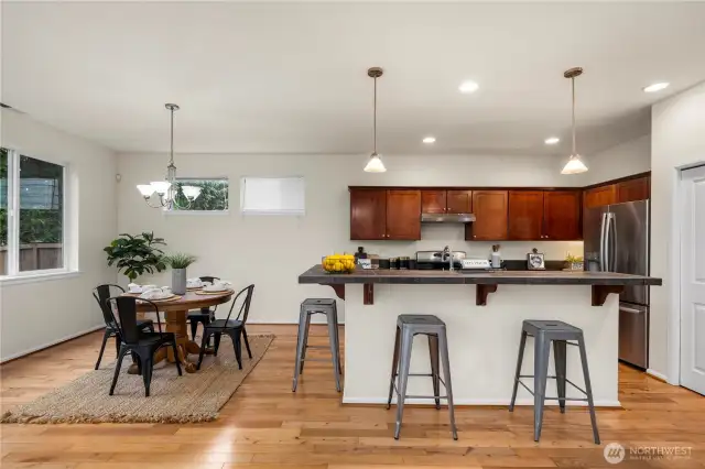 sprawling kitchen/dining area flows seamlessly out to the back patio and into the large living room!