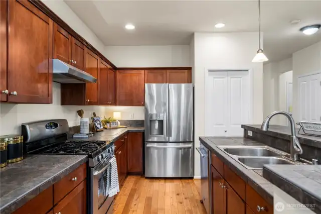 sprawling kitchen/dining area flows seamlessly out to the back patio and into the large living room!