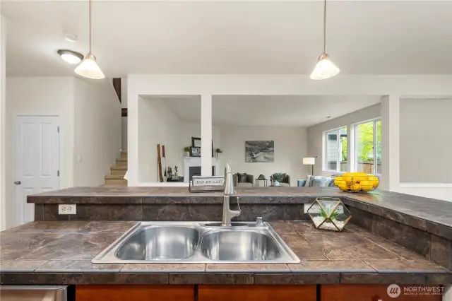 sprawling kitchen/dining area flows seamlessly out to the back patio and into the large living room!