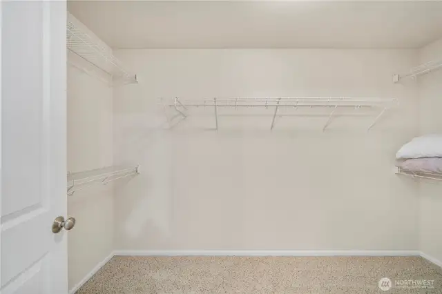 Primary bedroom walk-in closet