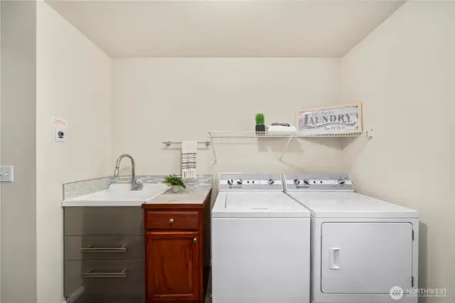 upstairs laundry rm is massive & includes a sink.