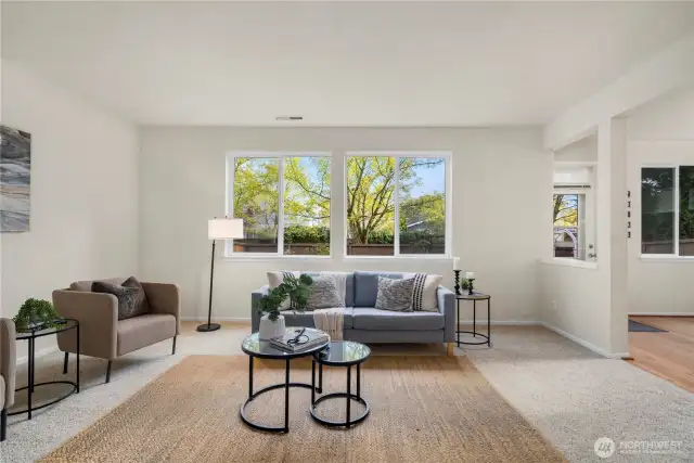 The living room is massive and is open to the large kitchen + dining room