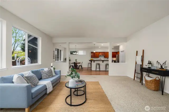 The living room is massive and is open to the large kitchen + dining room