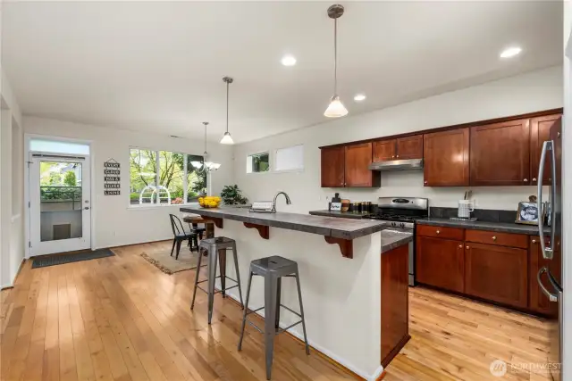 sprawling kitchen/dining area flows seamlessly out to the back patio and into the large living room!