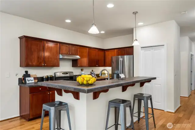 sprawling kitchen/dining area flows seamlessly out to the back patio and into the large living room!