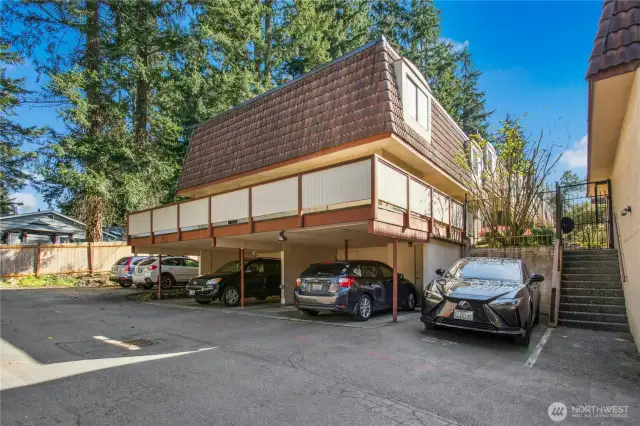 view of unit and deck from parking area.  note the steps for easy access to the unit.