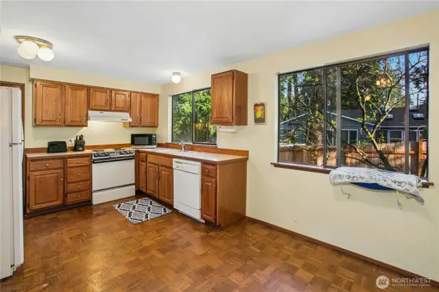 Spacious Kitchen with dining area.  Large windows allow for year round light.