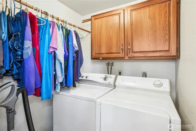 Laundy room with full size washer and dryer that stay.