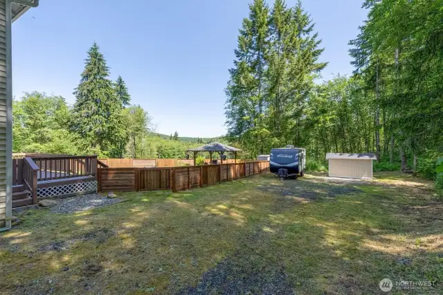 Fenced Back Yard. Plentiful Parking. RV Parking. Outbuilding. Room for a Shop.
