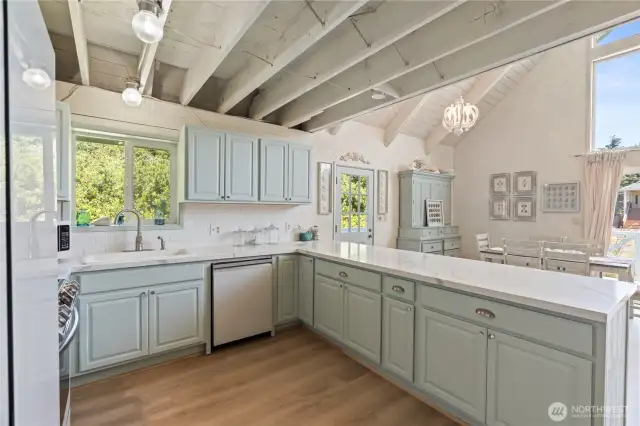 New cabinets in kitchen with quartz countertops