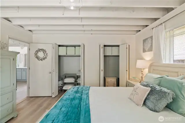 First level primary suite with double closets & exposed beams