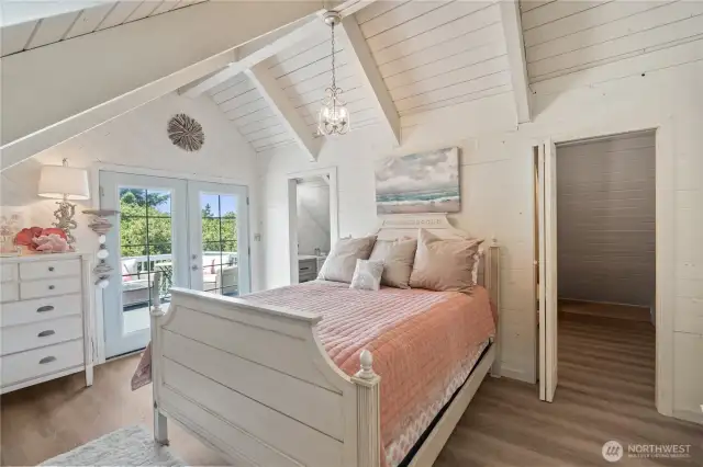 2nd level suite with walk-in closet, french doors to upper level deck, ensuite 3/4 bath