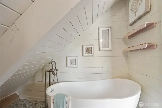 Soaking tub in upper ensuite bath