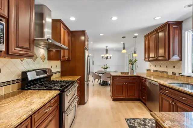 Stainless Steel appliances including hood, microwave, oven and dishwasher.