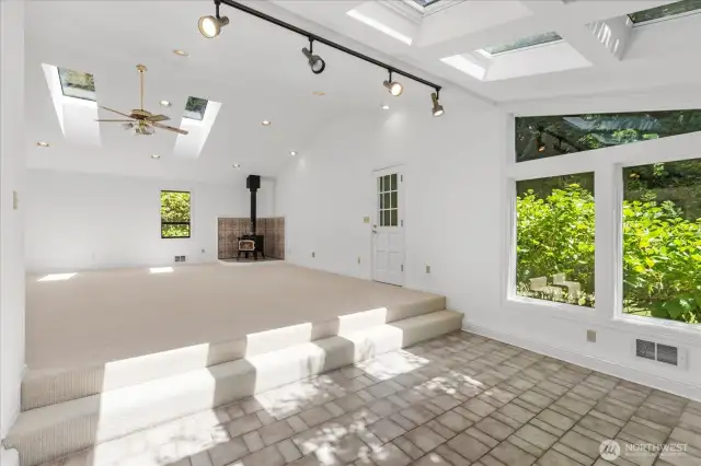 Adjacent to the rec room, step down to this well built sun room.