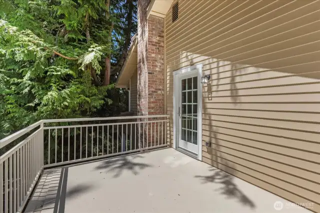 Primary suite has private deck just step through the beautiful glass doorway.