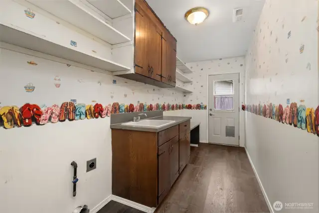 Lower Level Laundry Room w/ access to back yard.
