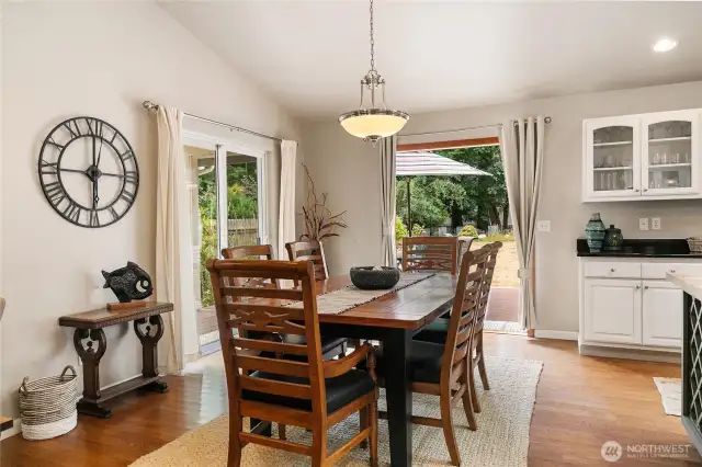 Sliding doors to the left lead to a covered patio area, while the French doors straight ahead invite you into your expansive backyard retreat.