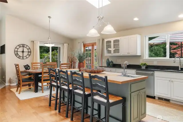 You will love this kitchen with a large island featuring butcher block countertops and a separate washing station.