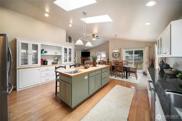 Ample storage throughout, including built-in cabinetry, an island, and a separate pantry—plenty of space for everything you need!