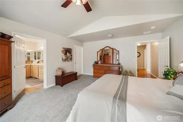 The far door to the right is your walk-in closet, to the left is your spacious 5-piece primary bath!