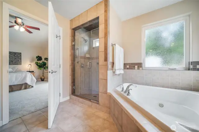 Soaking tub and walk-in tile shower!