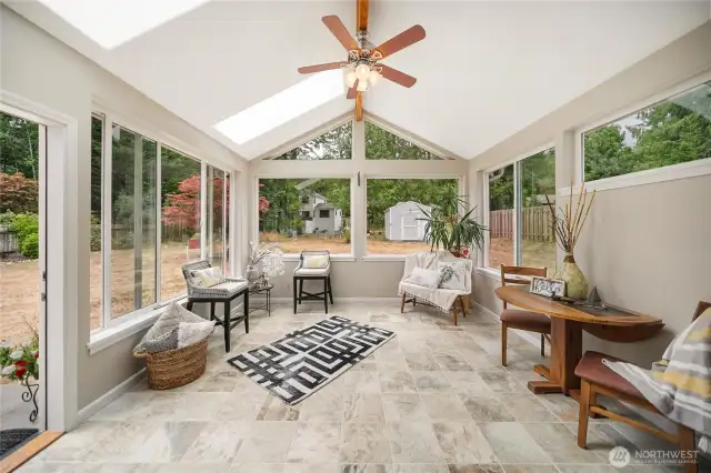 The 2013 addition of a stunning sunroom with heated tile floors offers the perfect space for year-round relaxation and enjoyment.