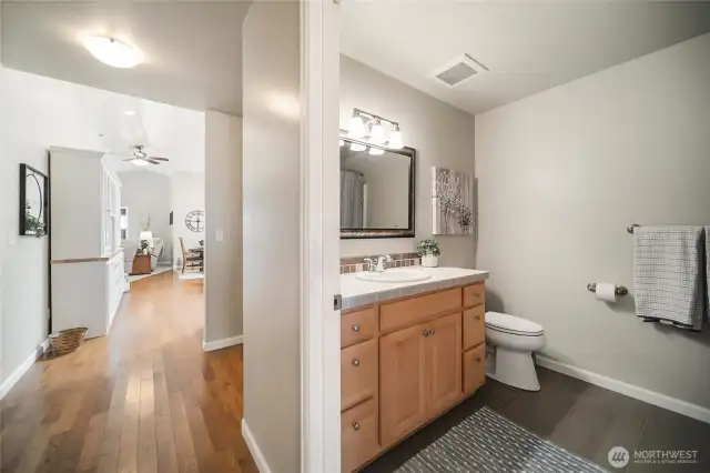 A full bathroom conveniently accessible for guests and dedicated to the second bedroom.