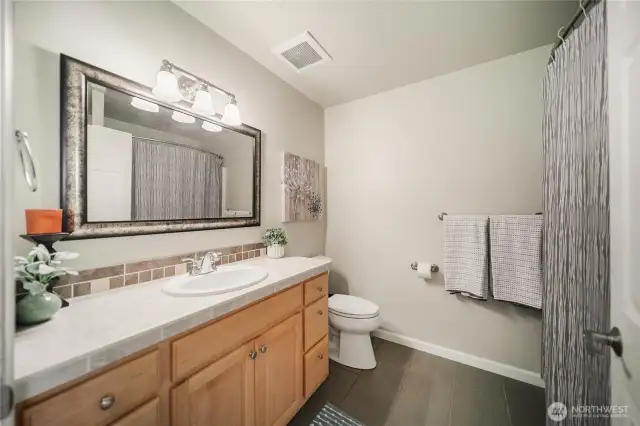 Beautiful tile flooring, spacious full bath.