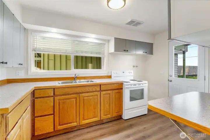 Kitchen comes with stove/range and all new flooring. Have your big gatherings here!