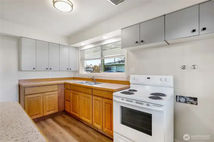 Kitchen window looks out toward the carport.