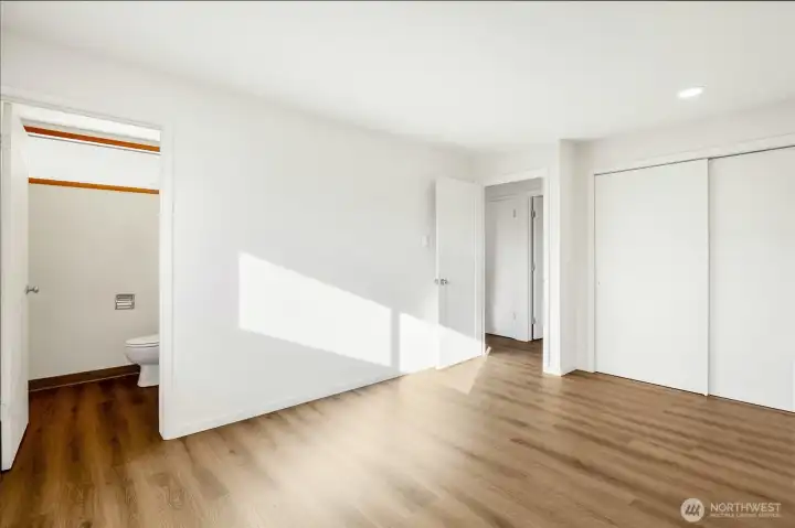 Primary bedroom with half bath.