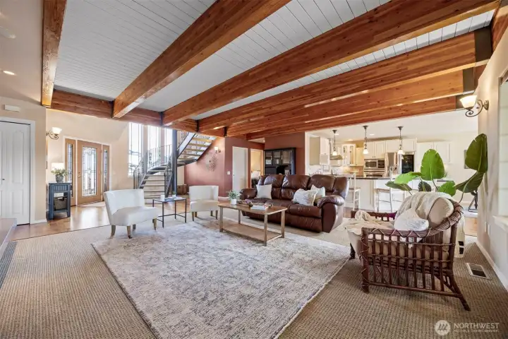 The beamed ceiling creates gives this very spacious living room an extra dose of warmth