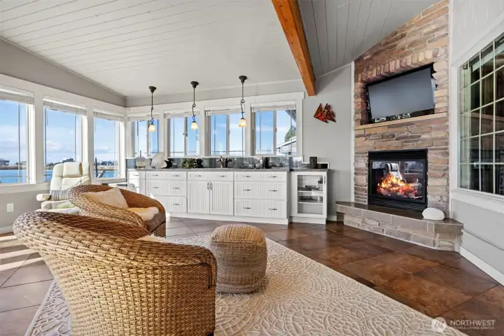 This sunroom is surrounded by windows on 3 sides and is truly a four season space with heating and cooling