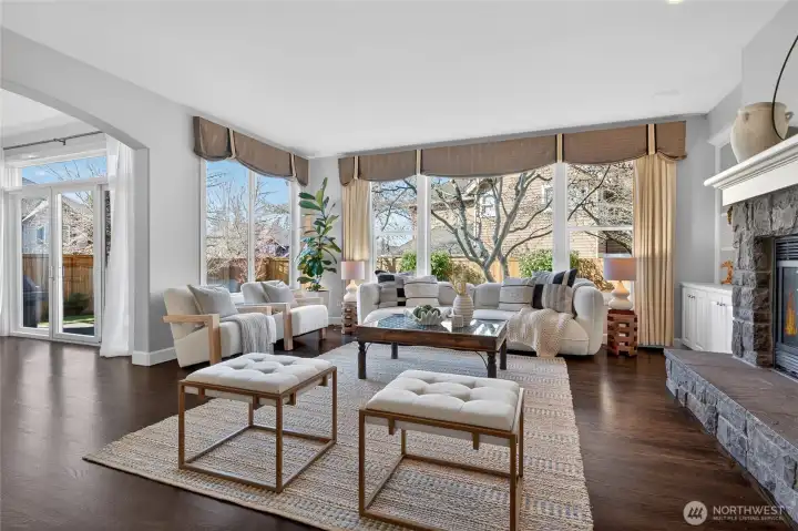 Gracious family room off the kitchen with gas fireplace and huge windows!