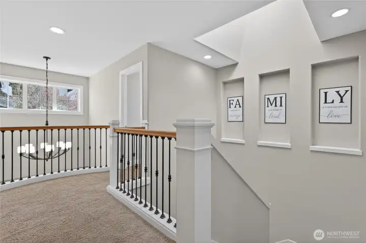 Peek down to the entry room and notice the additional architectural details & skylight!