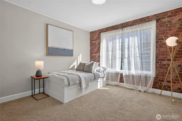 Faux brick feature wall in this fun bedroom.