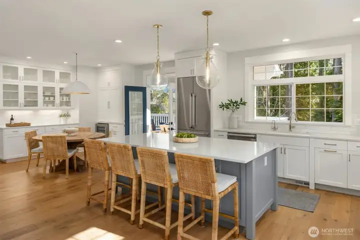 View to the in-kitchen dining room with French doors to the expansive new deck!
