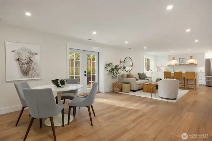 The 1700+sf lower level living space with heating/cooling + heated floors;  kitchen, 3/4 bath, a bedroom, sauna room and media room + a private entrance option.