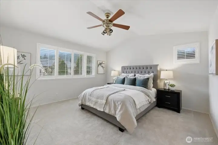 Primary bedroom overlooking the backyard