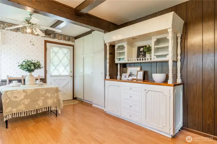 Kitchen with eating area, serving hutch and ample storage.