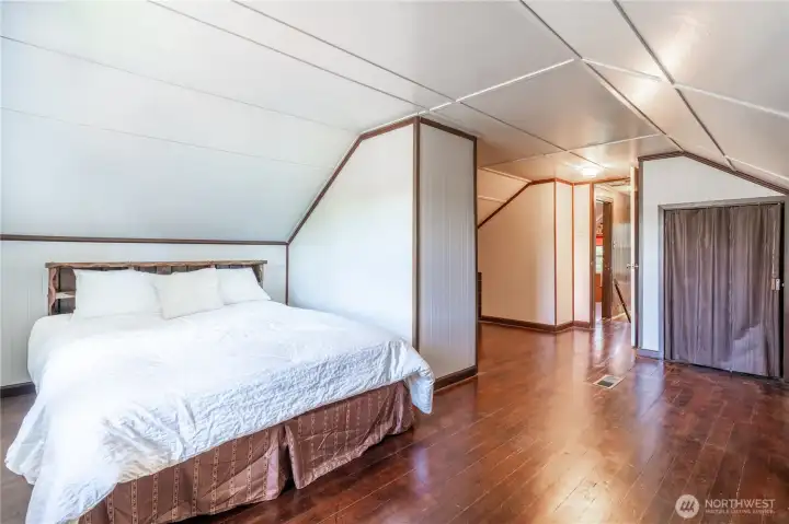 Upstairs Studio style bedroom with ample room for study and project space.