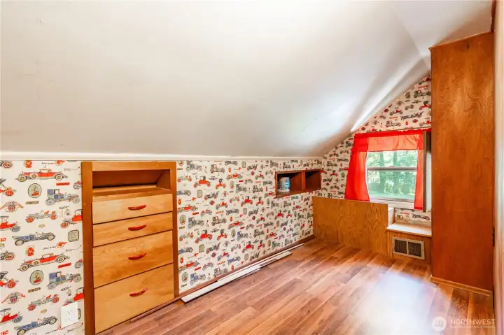 Upstairs bedroom, project room, or mini studio complete with vintage wallpaper.