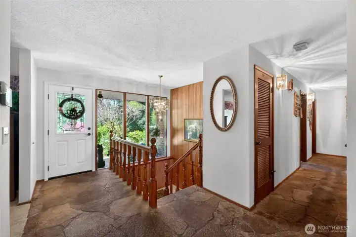 Original architectural details, including classic flagstone flooring on the main level, add timeless character and charm. Original architectural details, including classic flagstone flooring on the main level, add timeless character and charm.