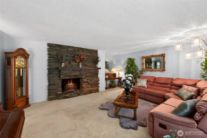 Expansive formal Living Room is highlighted by this gorgeous rock fireplace. Expansive formal Living Room is highlighted by this gorgeous rock fireplace.